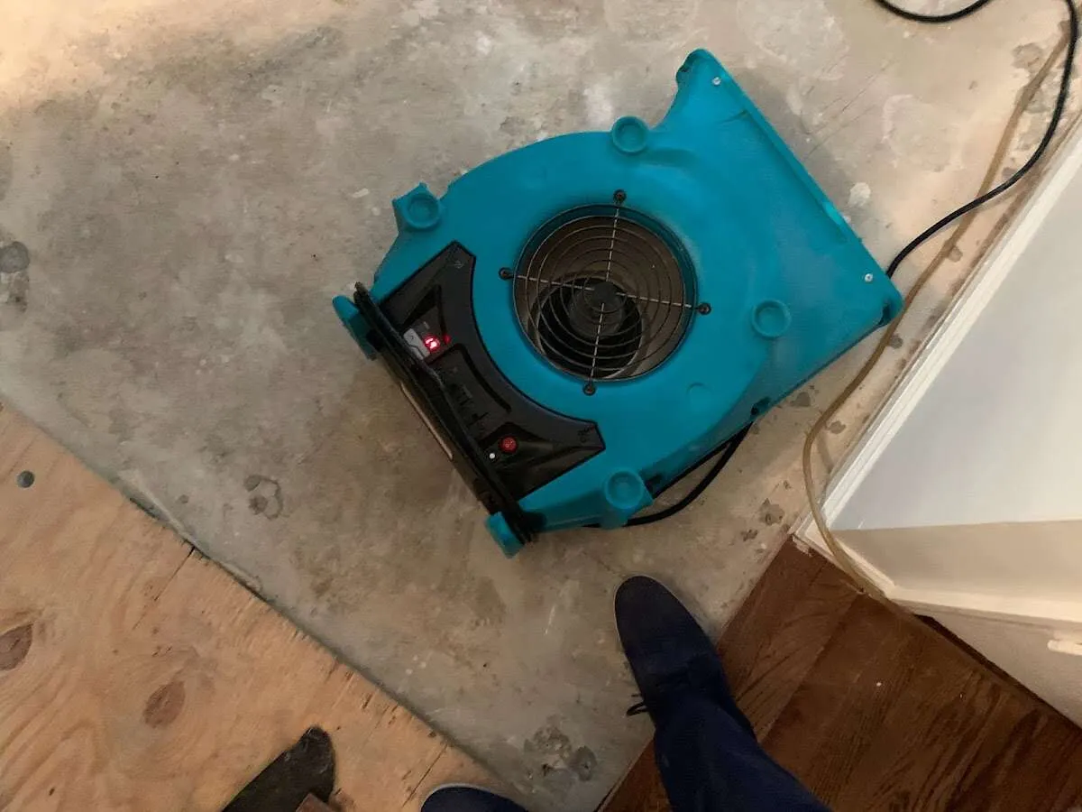 Air mover drying subfloor during Leak Detection & Repair in Searcy